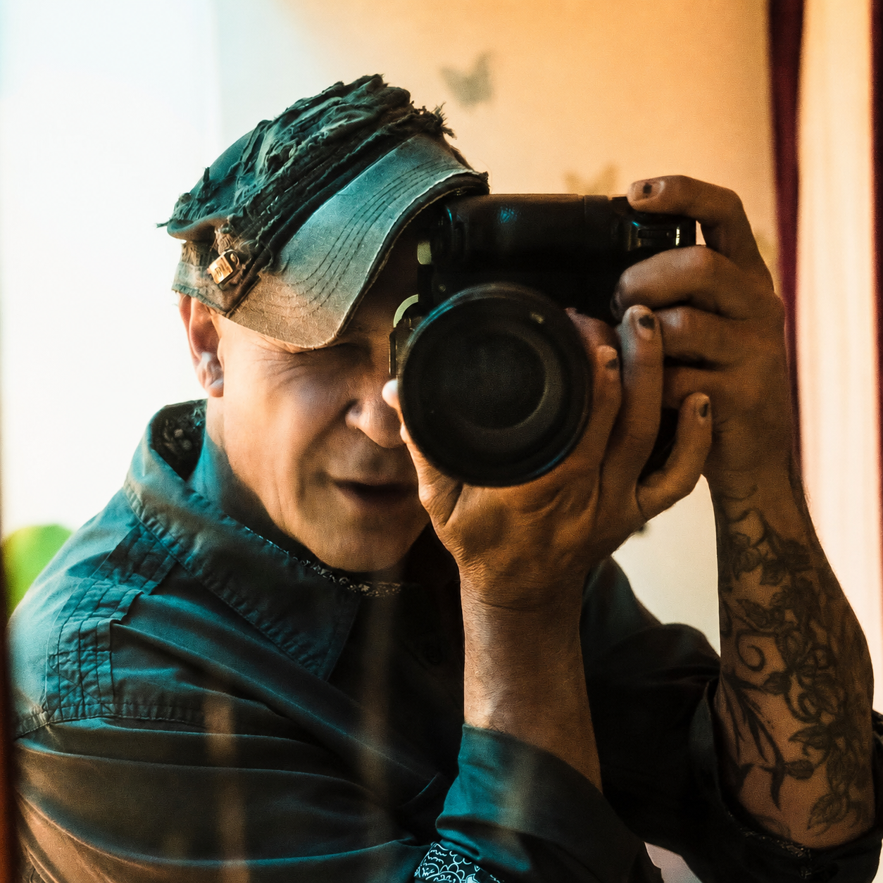 Doug Sanford making a self-portrait in a mirror